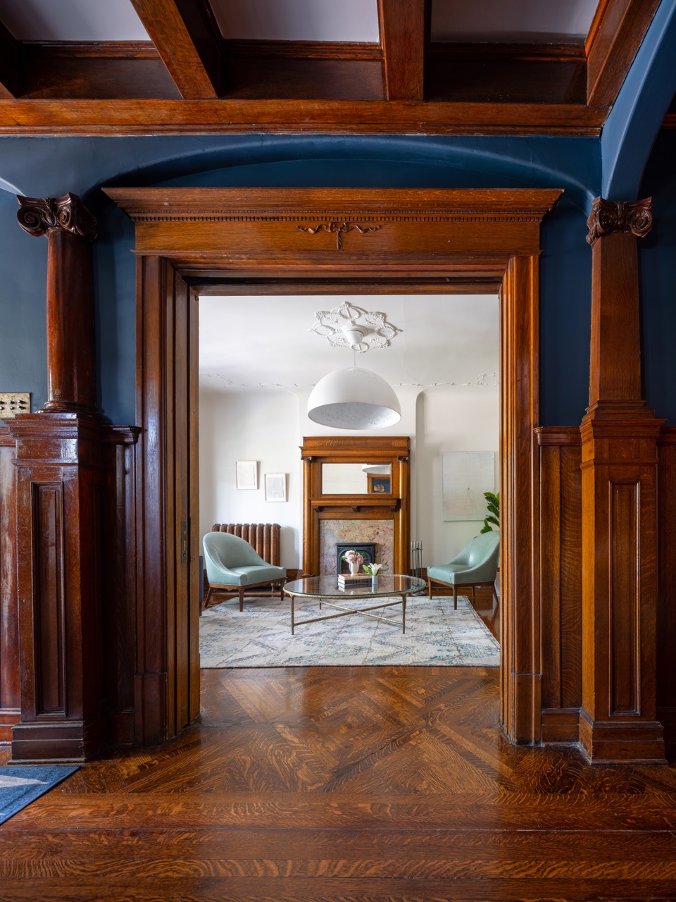 Rusholme Restored: This Rusholme home was reworked around one big, light-filled great room, where a whitewashed brick fireplace and full-height oak built-ins frame a media wall, and steel-framed glass doors fold open to the backyard