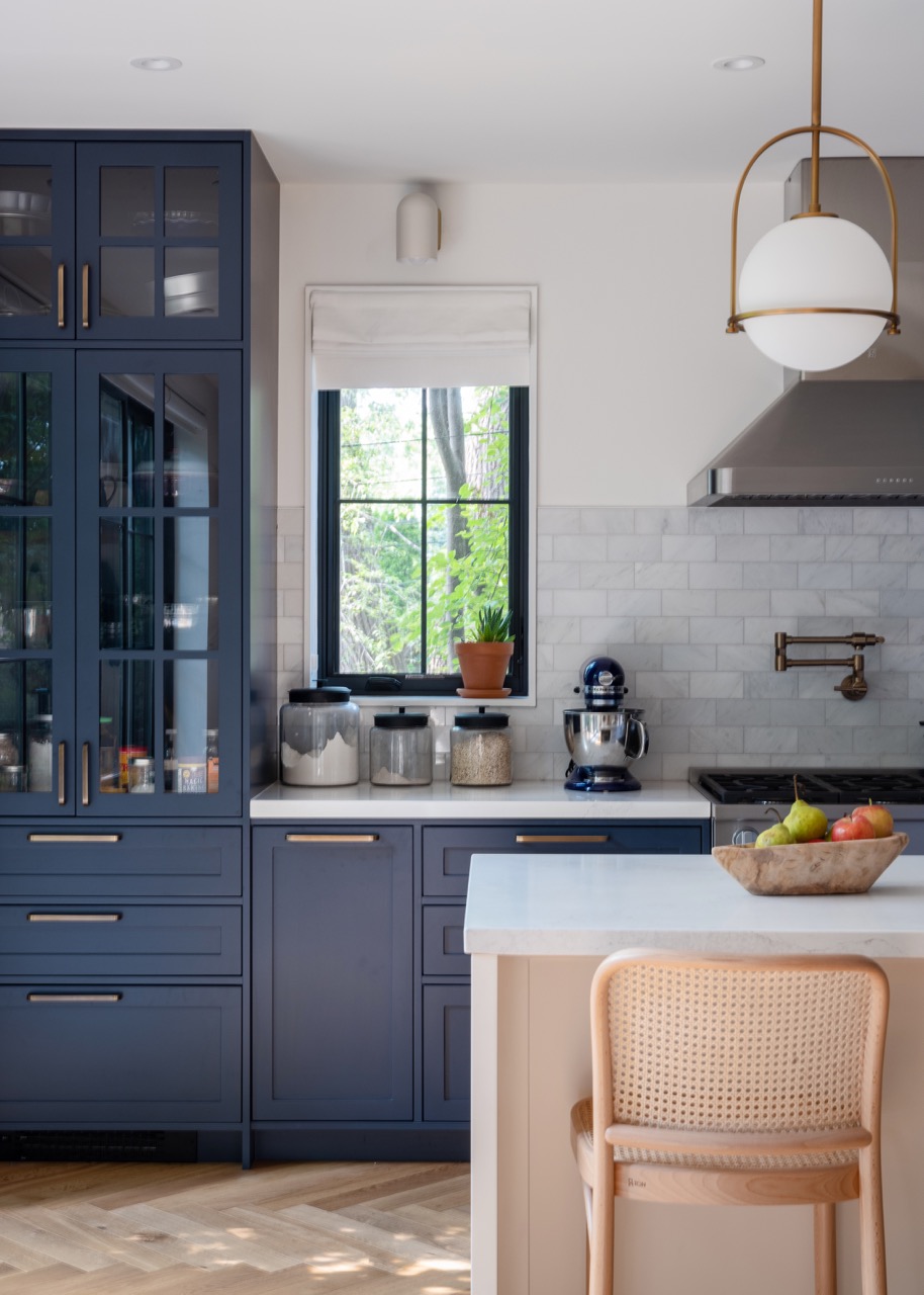 Rusholme Restored: Upstairs, statement botanical wallpaper anchors two bathrooms finished with white oak vanities, farmhouse sinks, and brass fixtures, while a third bath keeps things bright with subway tile, a freestanding oval tub, and floating…