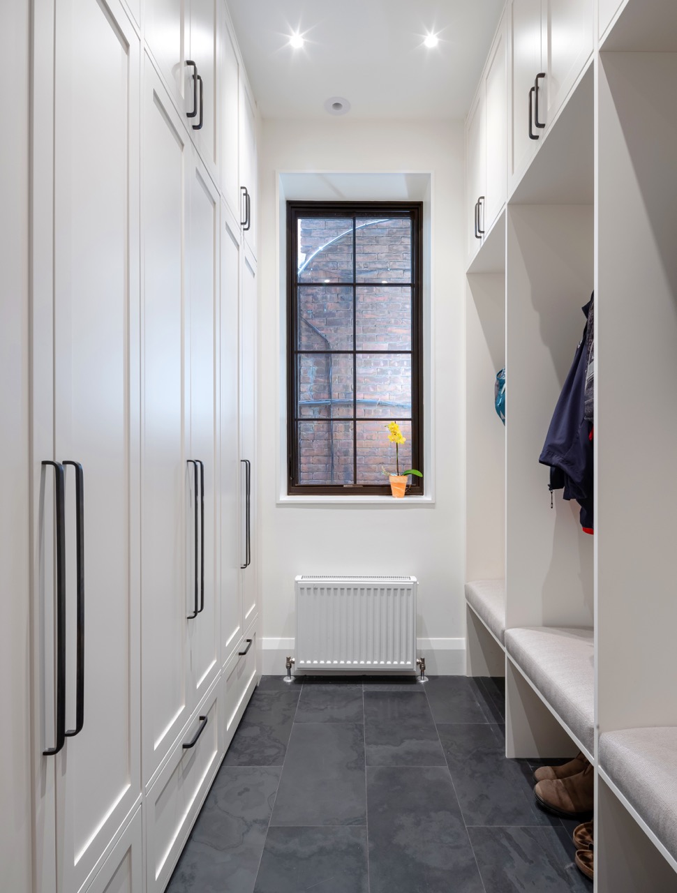 Rusholme Restored: Upstairs, statement botanical wallpaper anchors two bathrooms finished with white oak vanities, farmhouse sinks, and brass fixtures, while a third bath keeps things bright with subway tile, a freestanding oval tub, and floating…