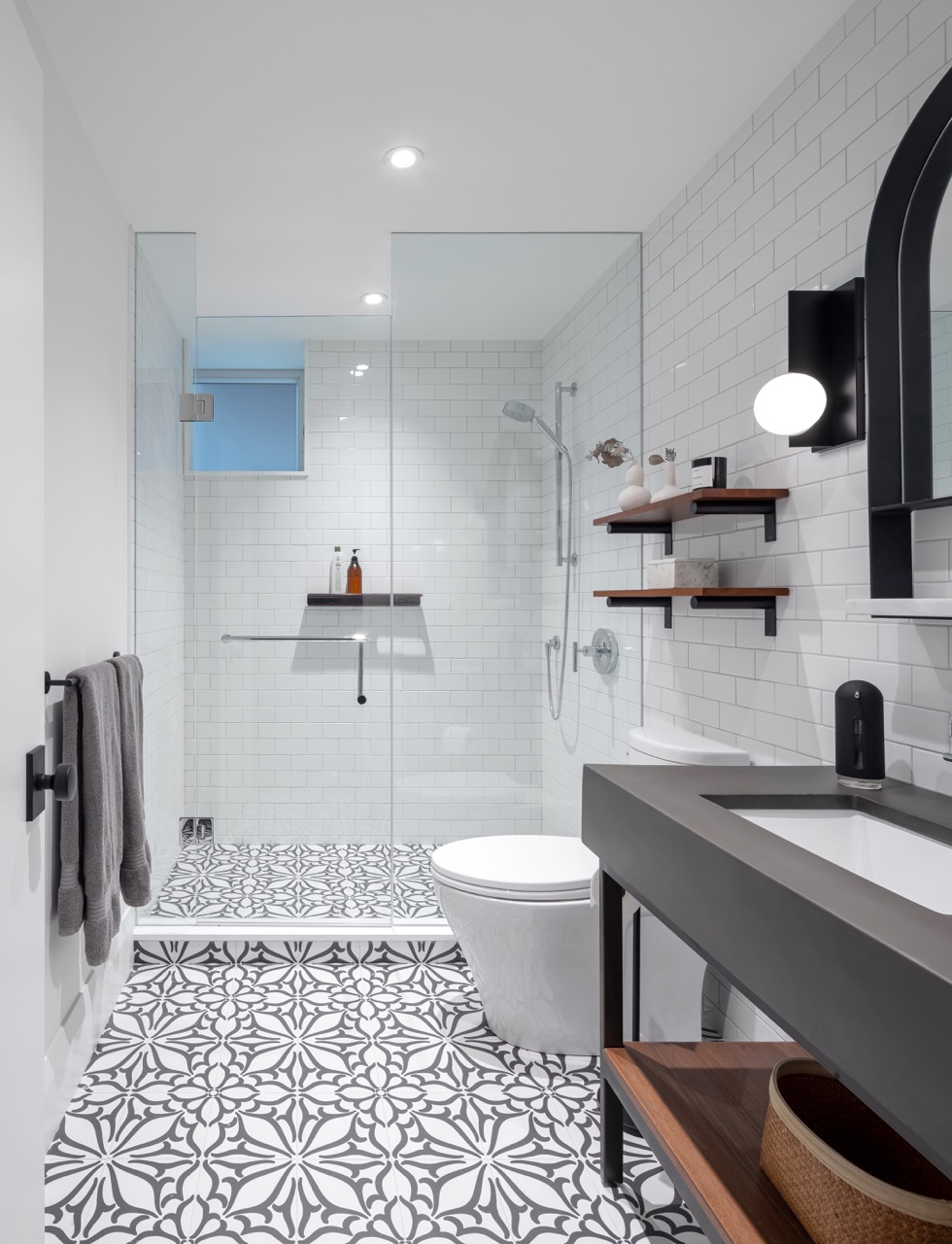 Rusholme Restored: This Rusholme home was reworked around one big, light-filled great room, where a whitewashed brick fireplace and full-height oak built-ins frame a media wall, and steel-framed glass doors fold open to the backyard
