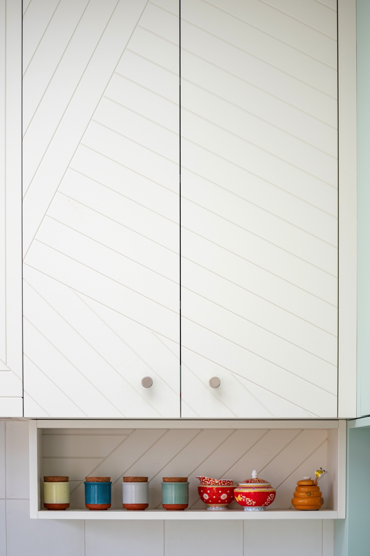Dufferin Grove: The interior design playfully combines original parts of the home with vintage elements as well as glass and steel and millwork to divide spaces for working, relaxing and entertaining