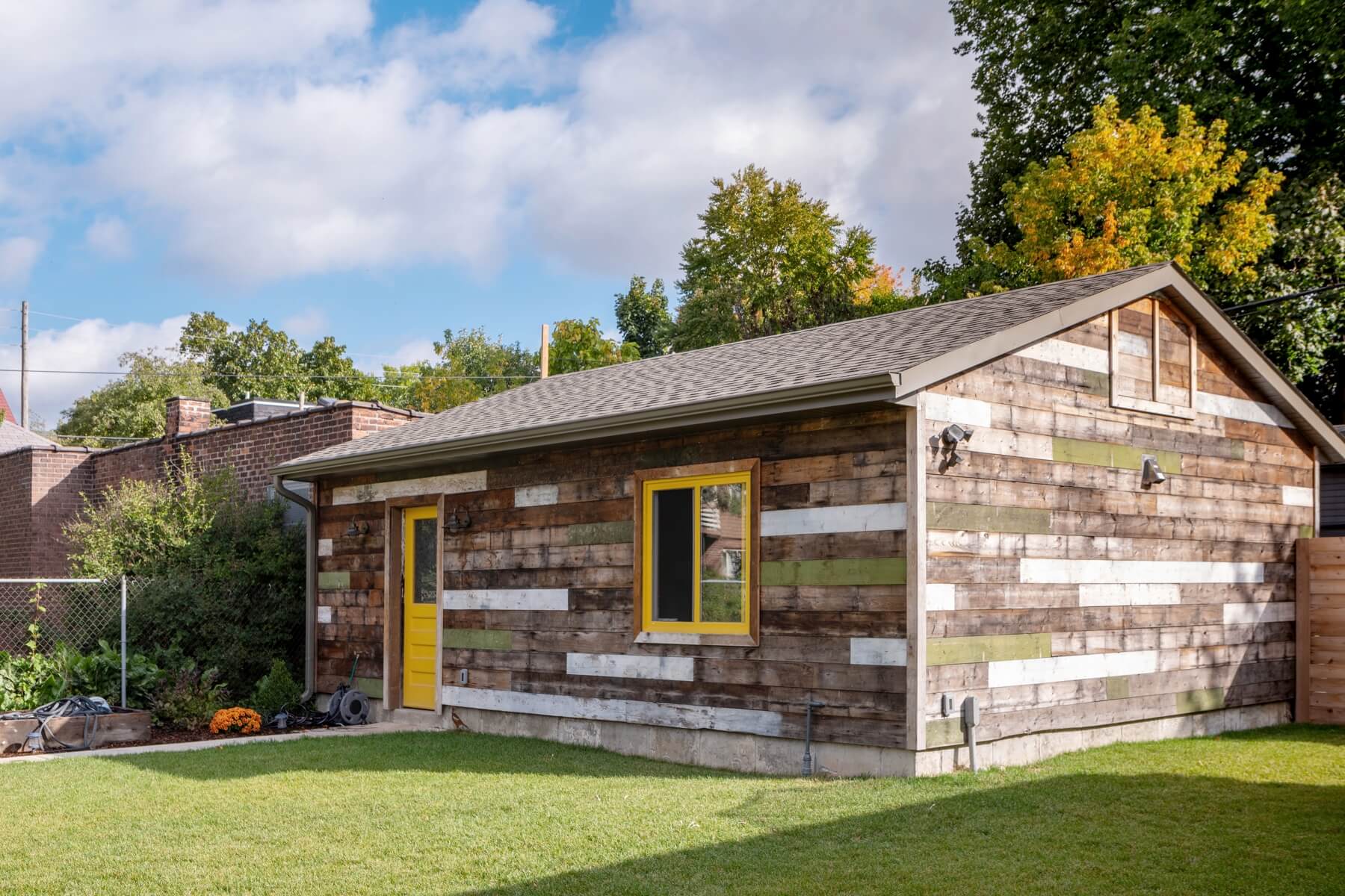 Dufferin Grove: A vaulted third floor contains the master bedroom and bathroom with a cozy library/lounge that walks out to the third floor deck - revealing views of the downtown skyline