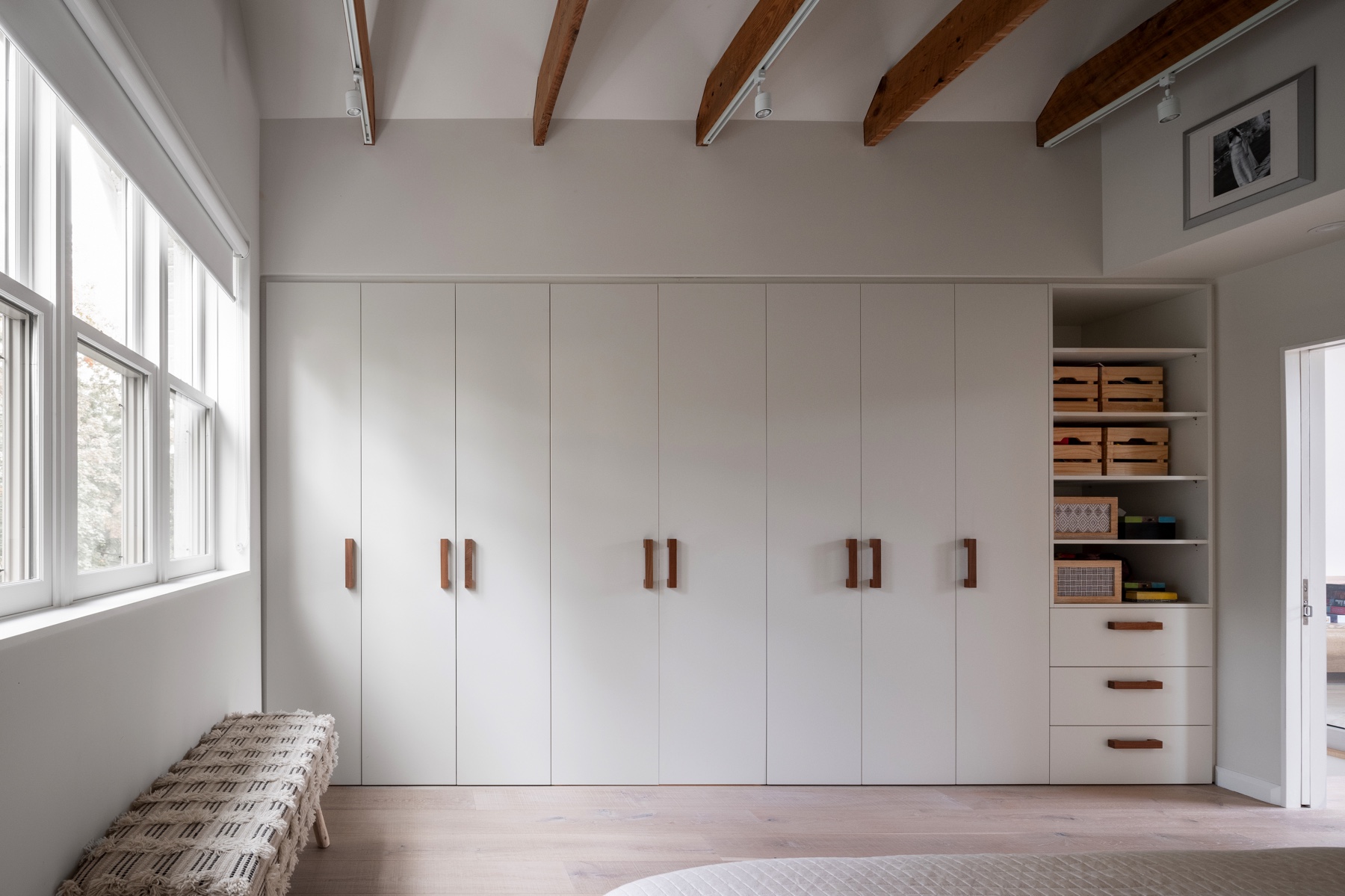 Dufferin Grove: The interior design playfully combines original parts of the home with vintage elements as well as glass and steel and millwork to divide spaces for working, relaxing and entertaining