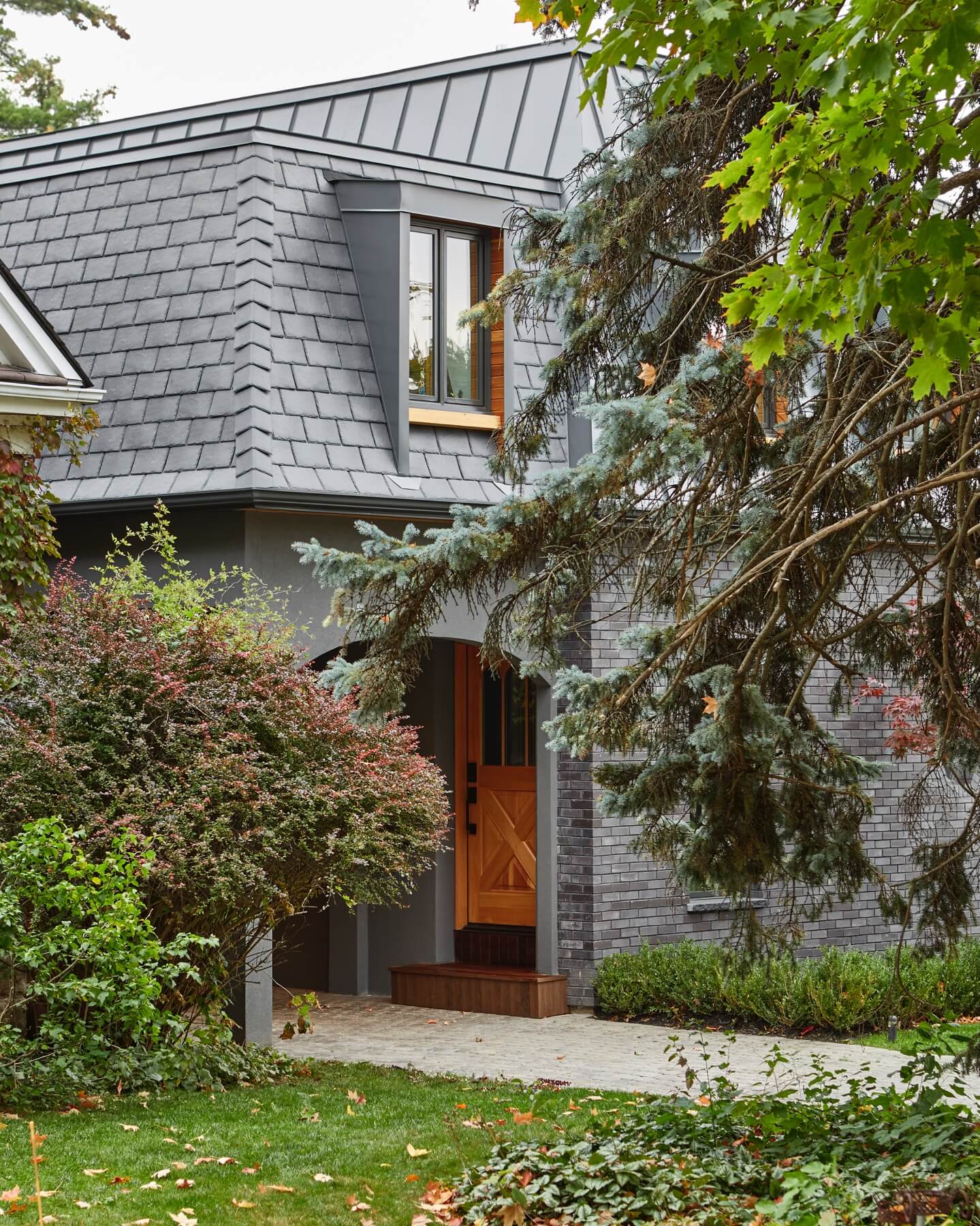 Islington Village: The elegant kitchen includes Calacatta marble countertops, Wolf range, SubZero glass paned refrigerator, open walnut shelving, blue/black cabinetry with hand forged bronze hardware and a larder with a SubZero freezer, wine fridge…