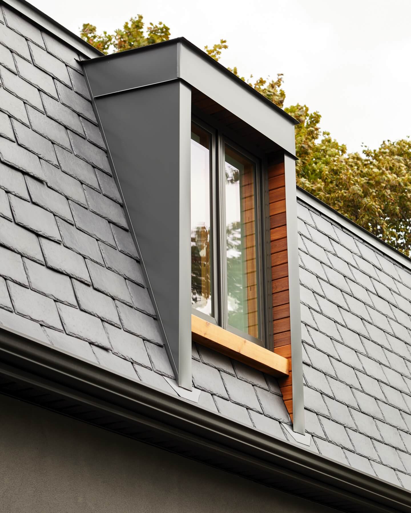 Islington Village: The emphasis on wood detailing continues with Pella fir windows framing a full view of the canopy of trees that hang over the golf course and back of the house