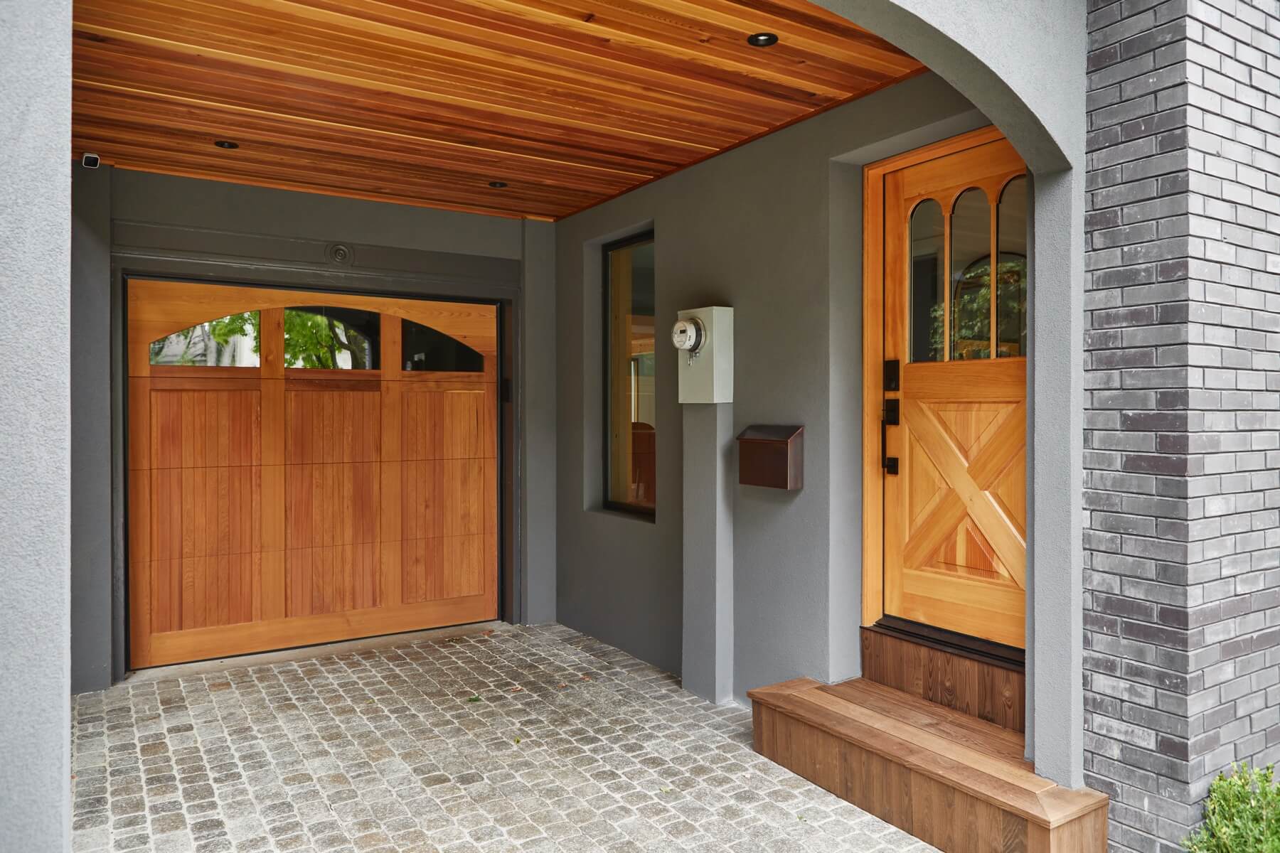 Islington Village: This project included a full reimagining of the backyard landscaping and features the use of Thermory decking and a refurbished in-ground pool surrounded by dark Eramosa limestone