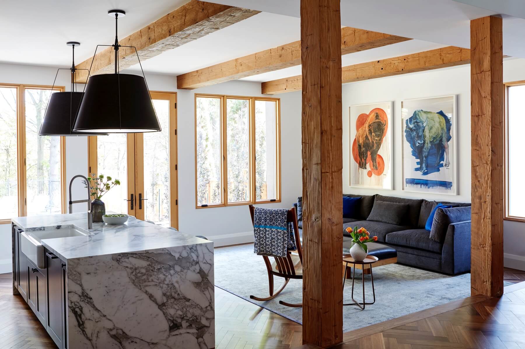 Islington Village: The main walnut waterfall staircase features a custom hand forged metal railing with tuning fork spindles