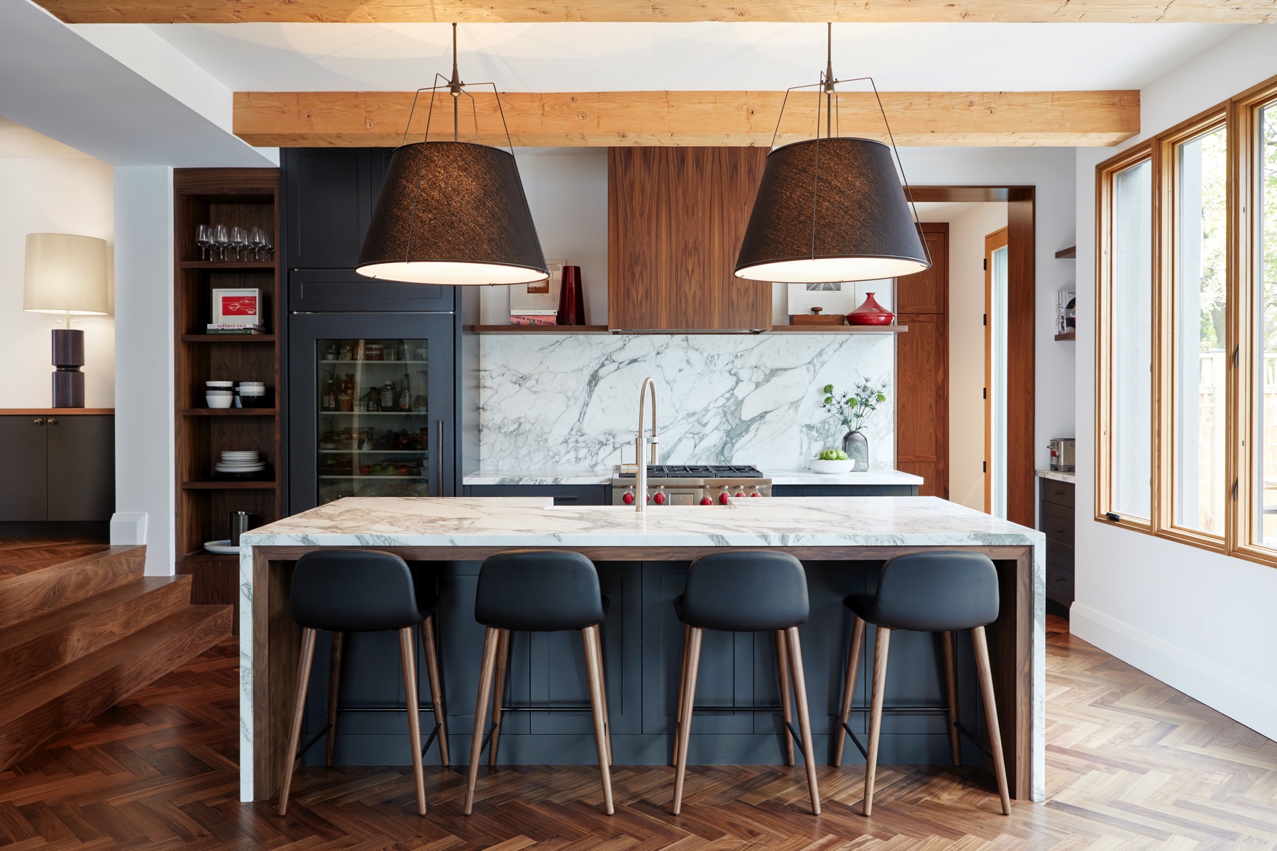 Islington Village: The elegant kitchen includes Calacatta marble countertops, Wolf range, SubZero glass paned refrigerator, open walnut shelving, blue/black cabinetry with hand forged bronze hardware and a larder with a SubZero freezer, wine fridge…