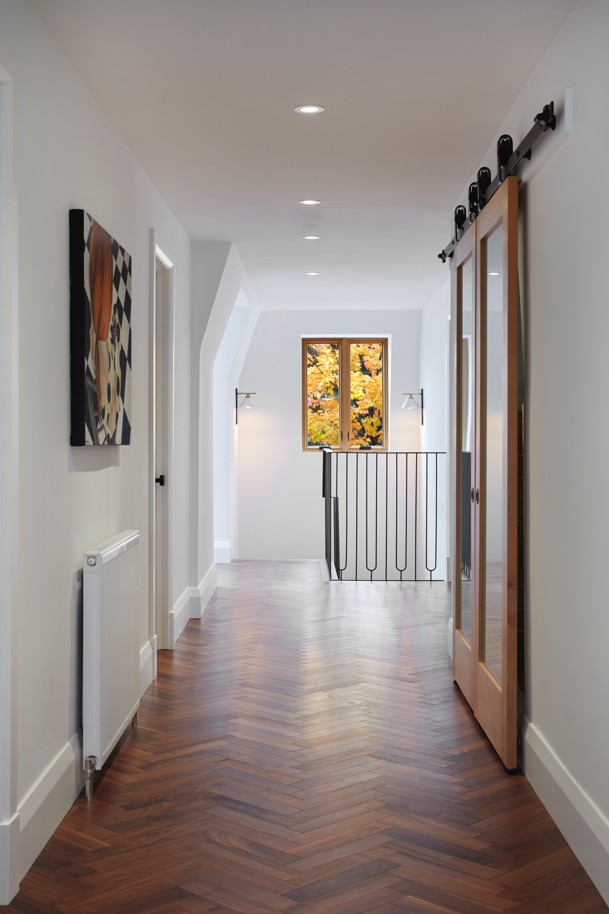 Islington Village: Design elements include the use of three species of wood, warm metals, various marbles, bespoke lighting fixtures and Canadian art as a focal point within each space