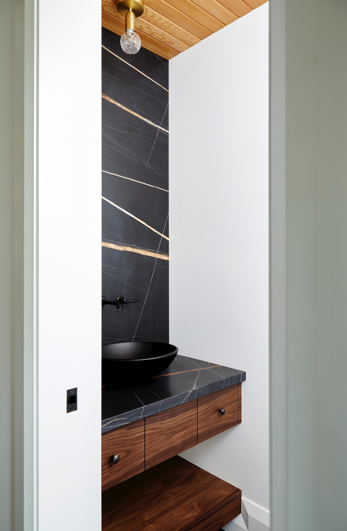 Islington Village: The elegant kitchen includes Calacatta marble countertops, Wolf range, SubZero glass paned refrigerator, open walnut shelving, blue/black cabinetry with hand forged bronze hardware and a larder with a SubZero freezer, wine fridge…