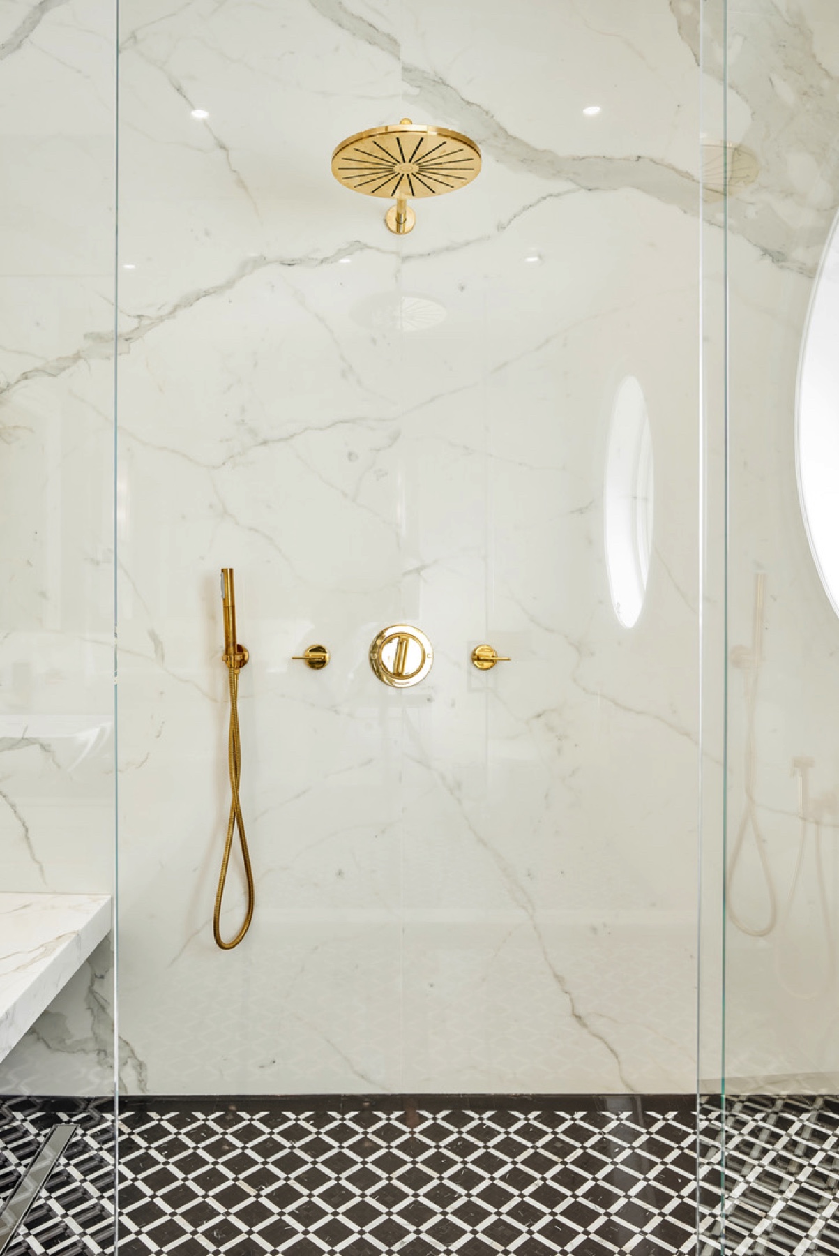 Manor Estate: The anything but understated kitchen makes a whimsical impression, featuring marble counters and backsplashes, cherry blossom mosaic tiling, powder blue custom cabinetry and metallic finishes of silver, brass, copper and rose gold