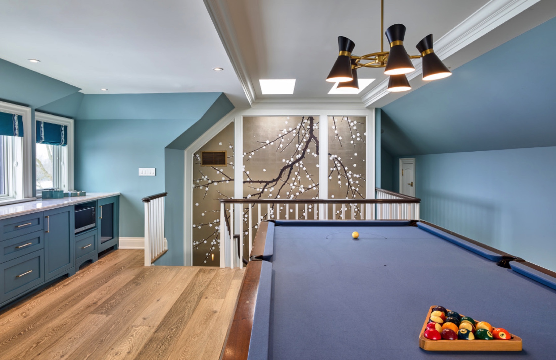 Manor Estate: The anything but understated kitchen makes a whimsical impression, featuring marble counters and backsplashes, cherry blossom mosaic tiling, powder blue custom cabinetry and metallic finishes of silver, brass, copper and rose gold