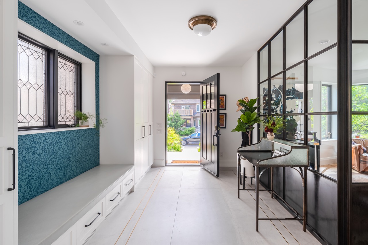 Picturesque Parkside: Black steel-framed glass doors divide the principal rooms without closing them off, and brass flush-mounts add warmth throughout