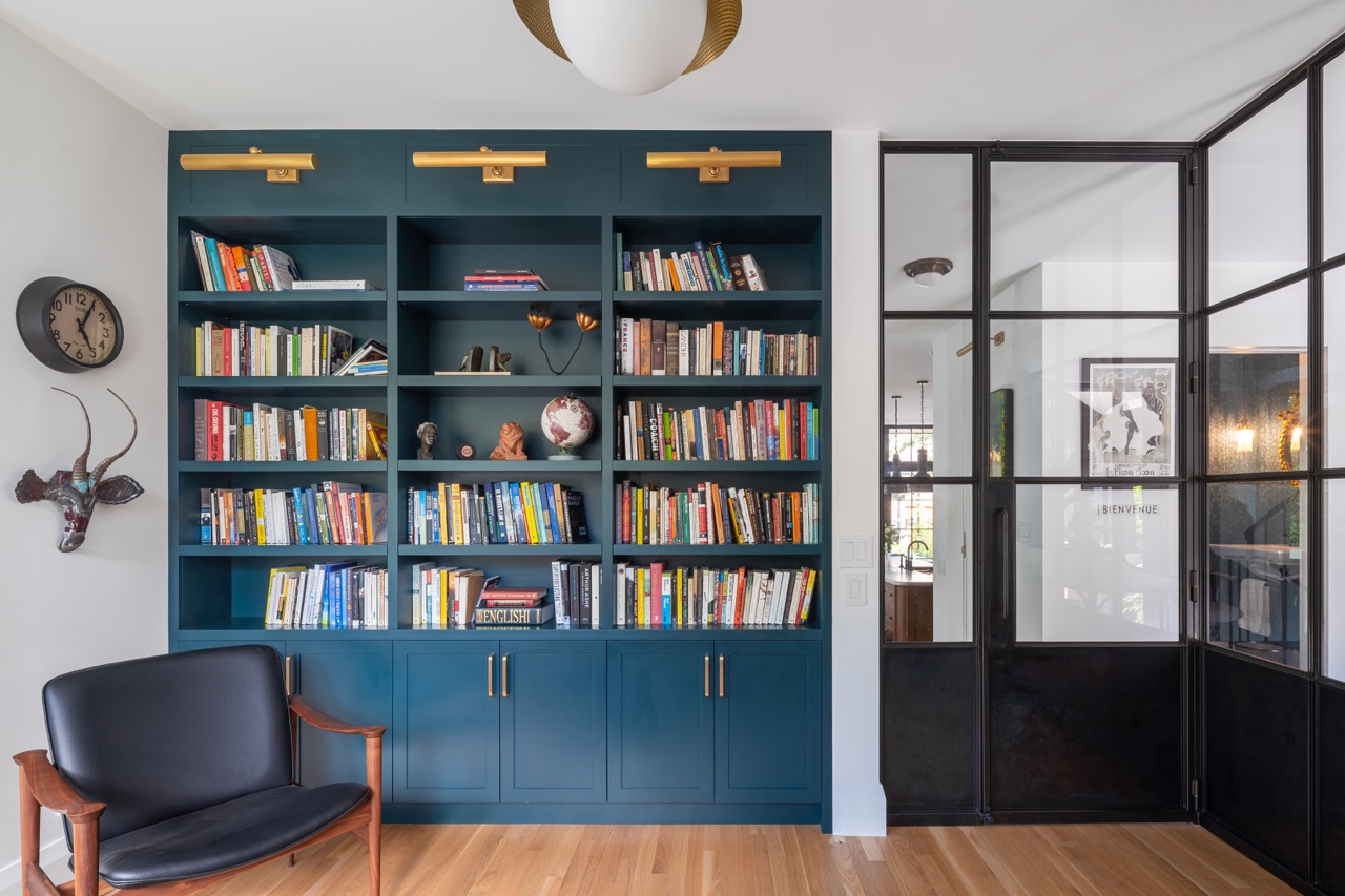 Picturesque Parkside: Black steel-framed glass doors divide the principal rooms without closing them off, and brass flush-mounts add warmth throughout
