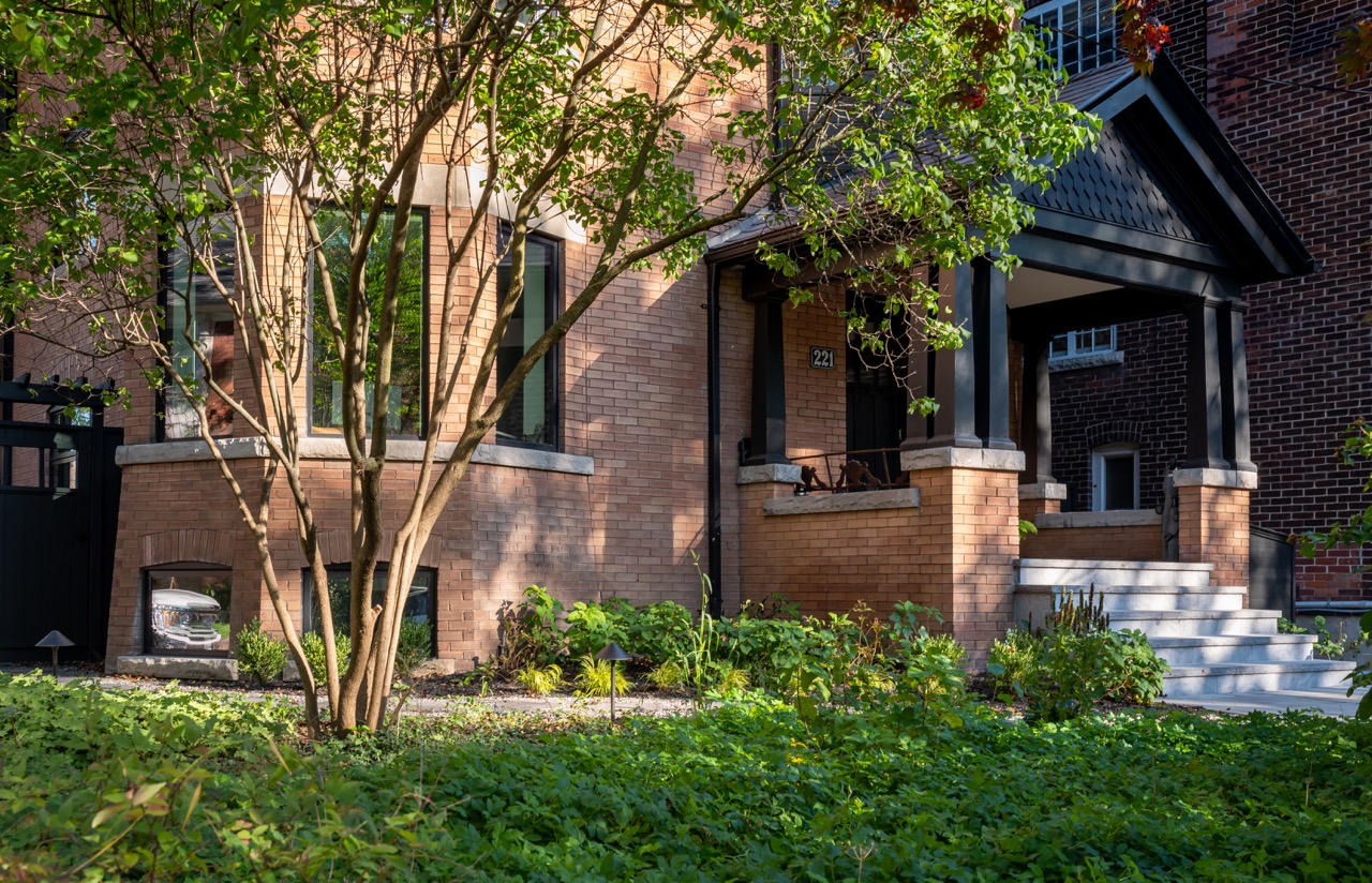 Picturesque Parkside: Black steel-framed glass doors divide the principal rooms without closing them off, and brass flush-mounts add warmth throughout