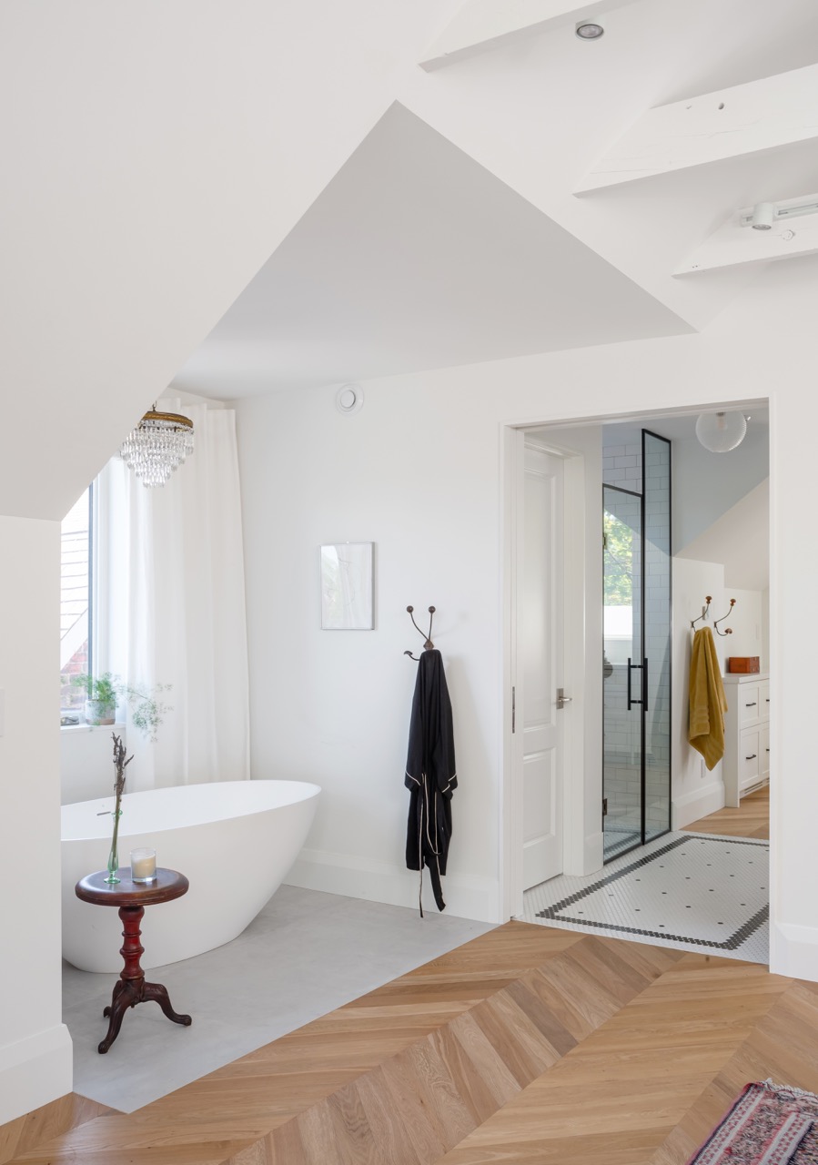 Picturesque Parkside: Black steel-framed glass doors divide the principal rooms without closing them off, and brass flush-mounts add warmth throughout