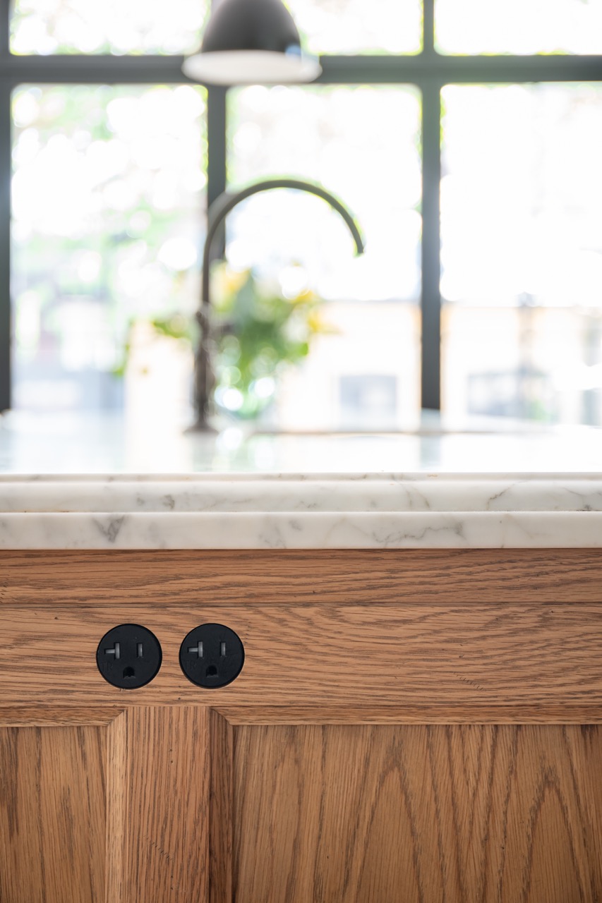 Picturesque Parkside: Black steel-framed glass doors divide the principal rooms without closing them off, and brass flush-mounts add warmth throughout