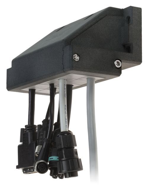 Black cable entry frame with various cables and connectors, fixed to a wall