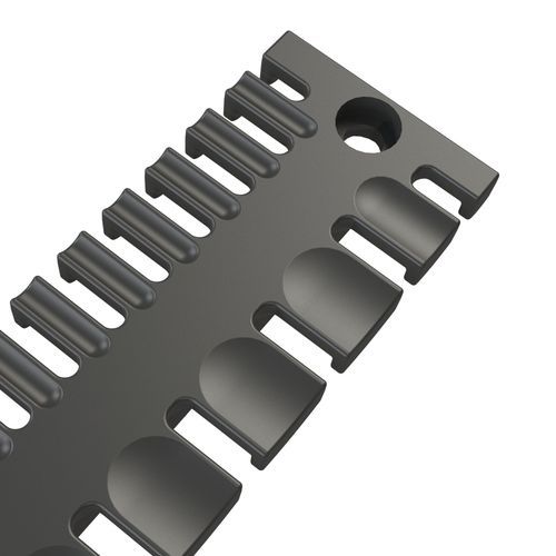 Dark grey cable entry with several half-round and rectangular openings for cable fixing