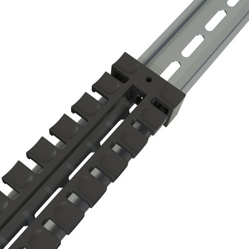 Black cable entry with strain relief fixed to a perforated metal rail