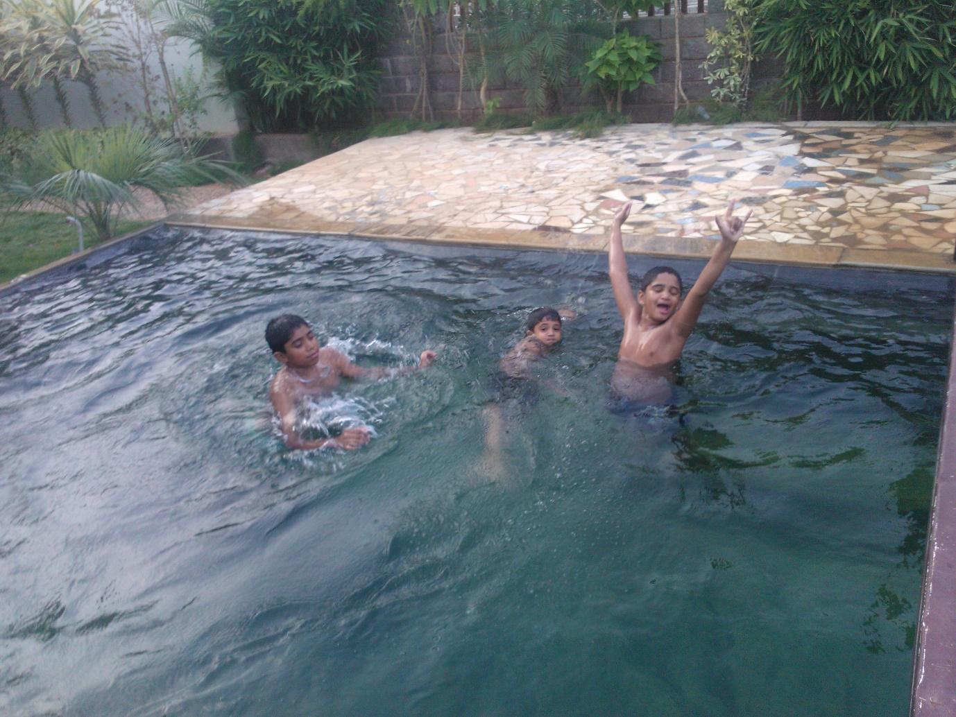A group of people in a poolDescription automatically generated