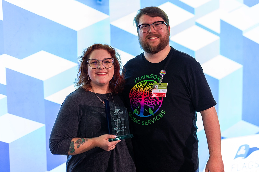 Pitch 2026 winner Kirby Gilliam (left) holds her award trophy. Standing next to her is her husband, Steven Erlandson.