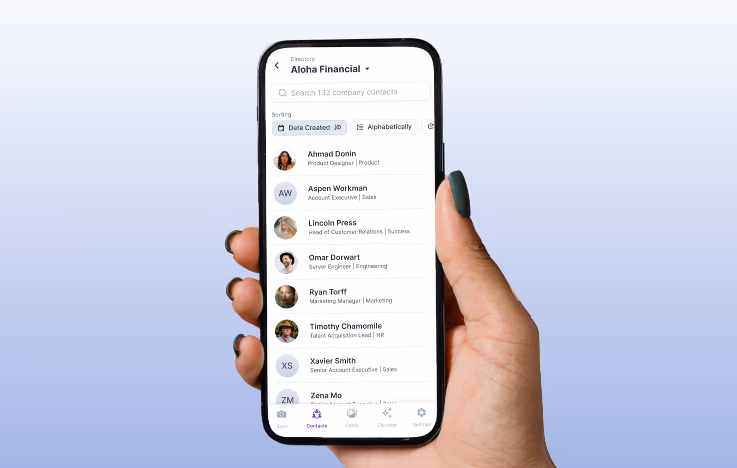 Hand holding a phone showing the HiHello Employee Directory with colleague names displayed in search results.