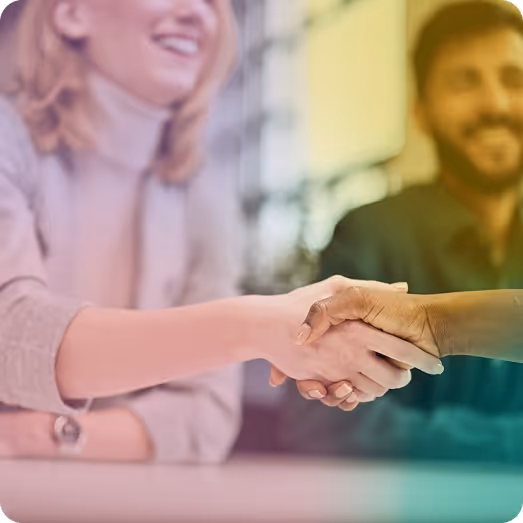 Business professionals shaking hands to close a deal, symbolizing enterprise partnerships and brand collaboration