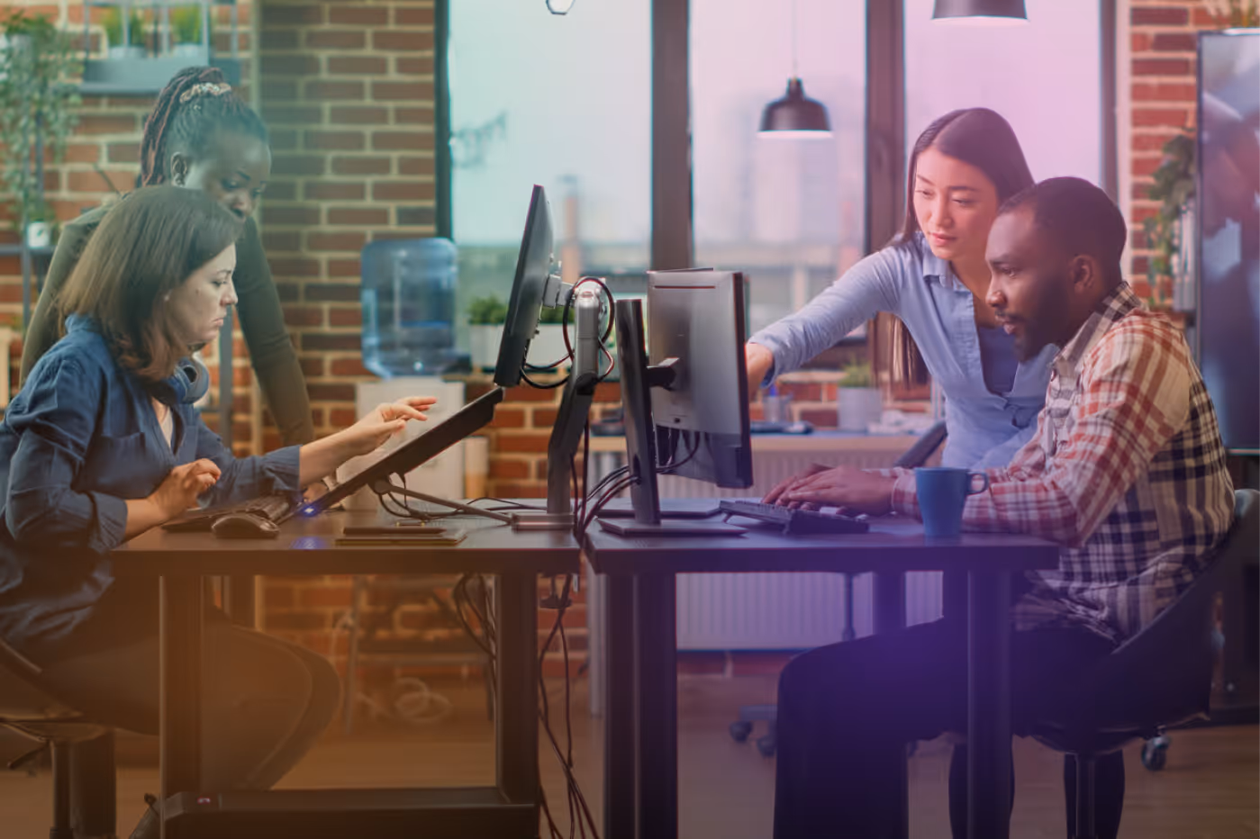 IT professionals working together on computers