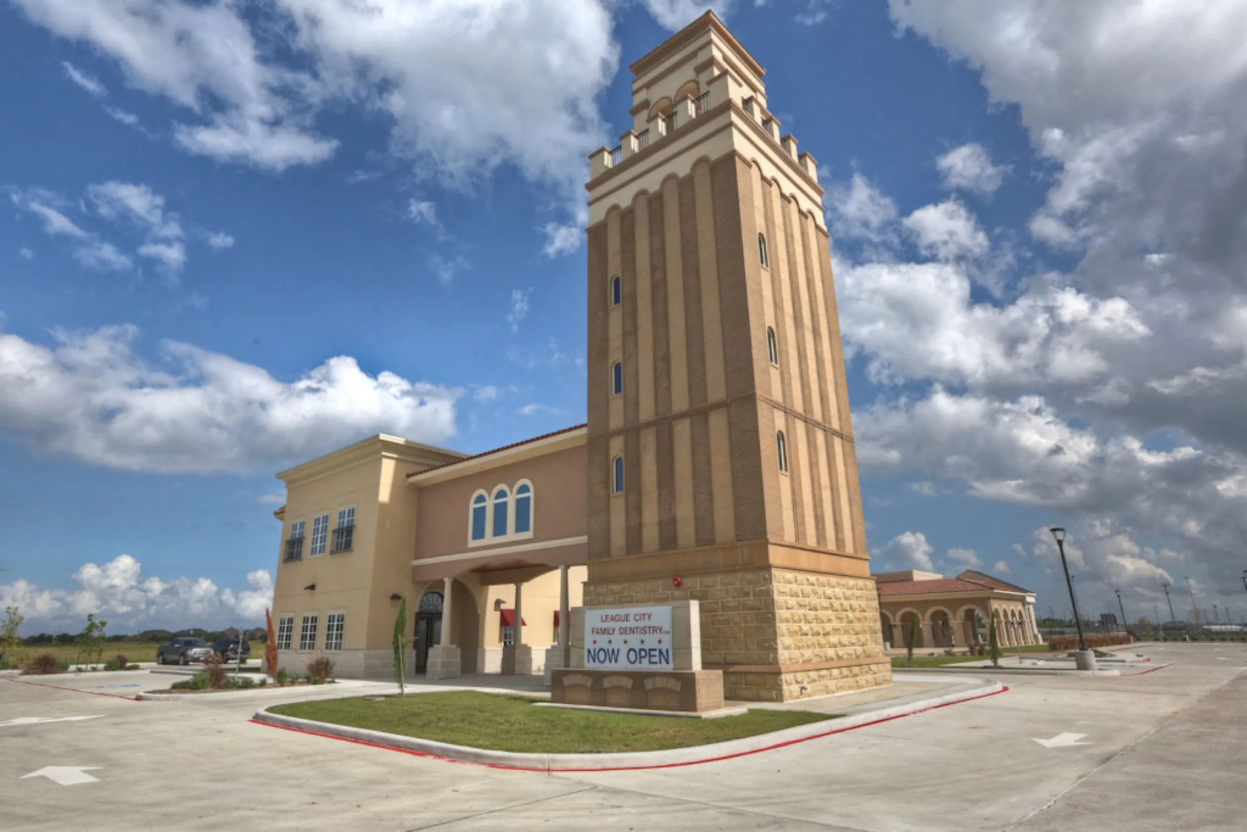 Physical building architecture for League City Family Dentistry featuring a custom Tuscan tower design, used by FAMGO Design as the creative inspiration for a cohesive, conversion-focused website and brand identity.