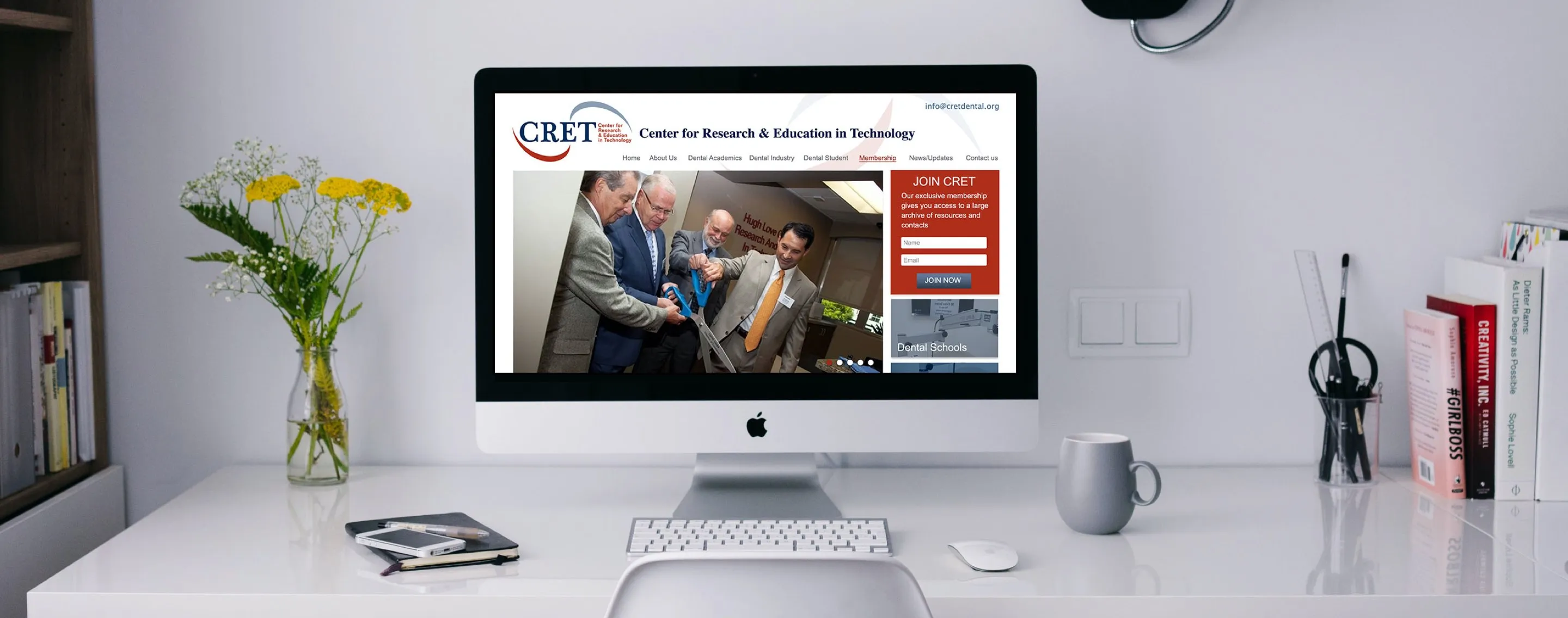 CRET website displaying on an iMac
