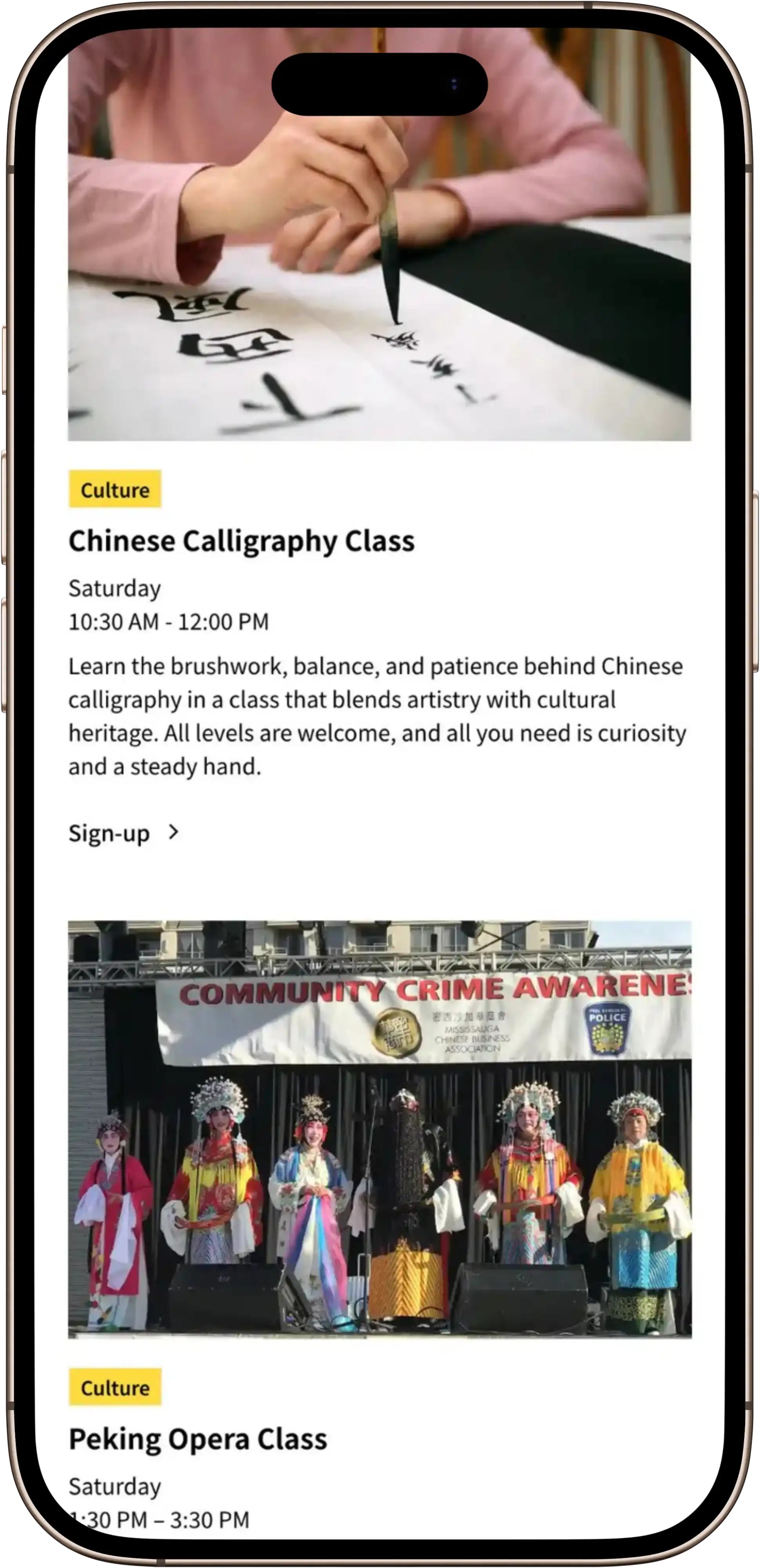 Smartphone screen showing a Chinese Association of Mississauga Calligraphy Class ad with a photo of a person writing calligraphy. Below is a Peking Opera Class ad with a photo of six performers in colourful traditional opera costumes on stage.
