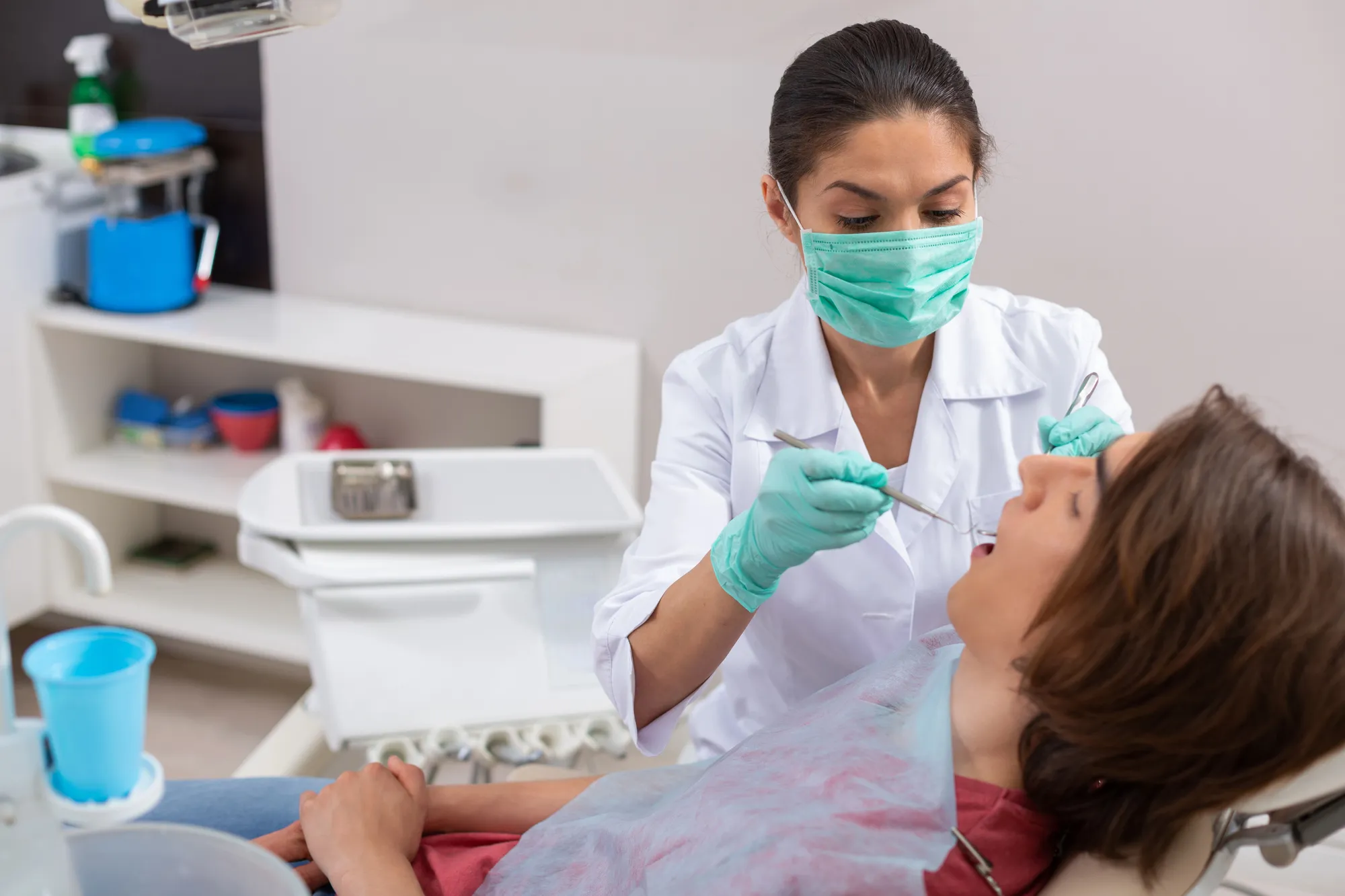 Girl undergoing periodontal treatment by a dentist in Broward County 