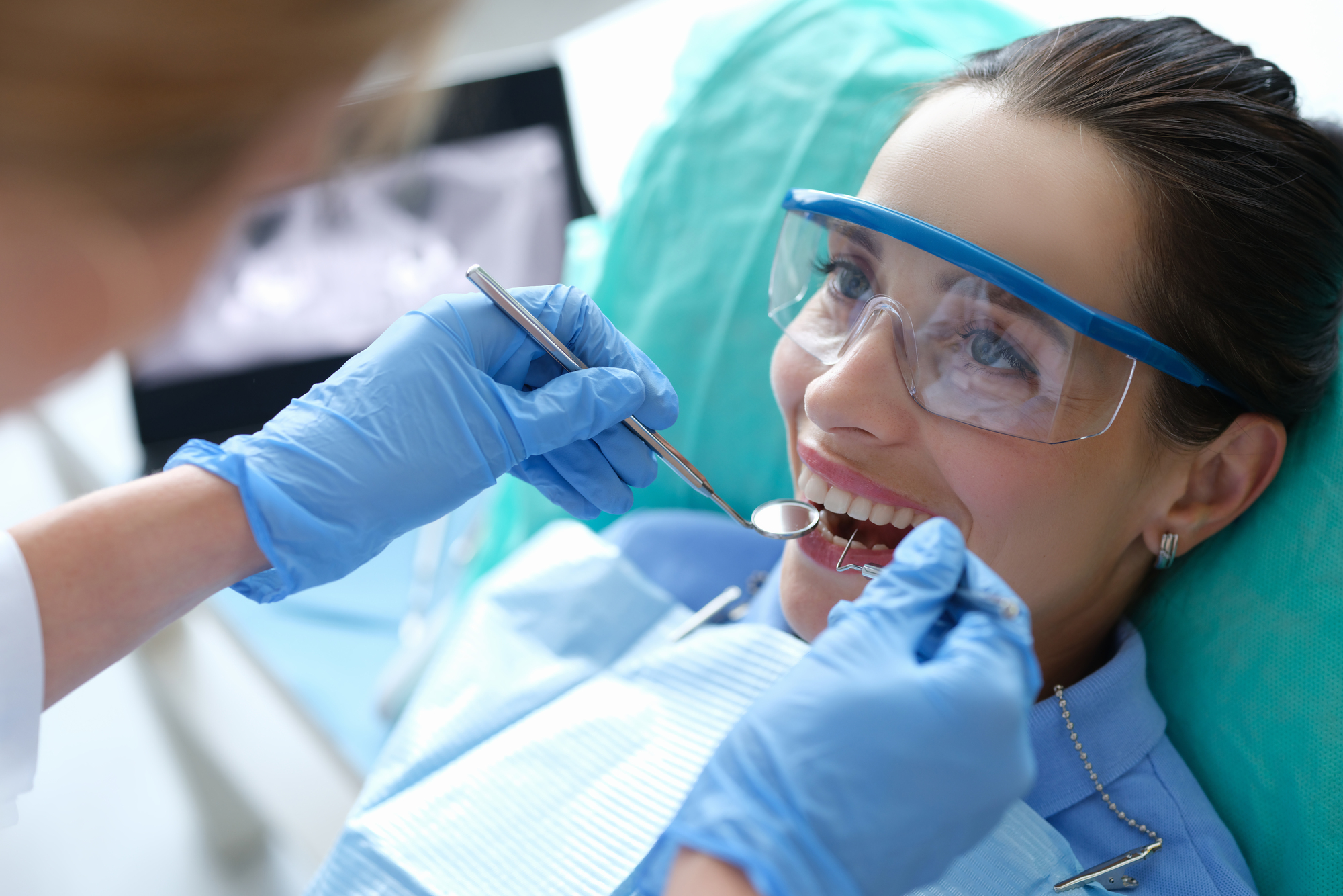 woman getting dental checkup to get Invisalign services