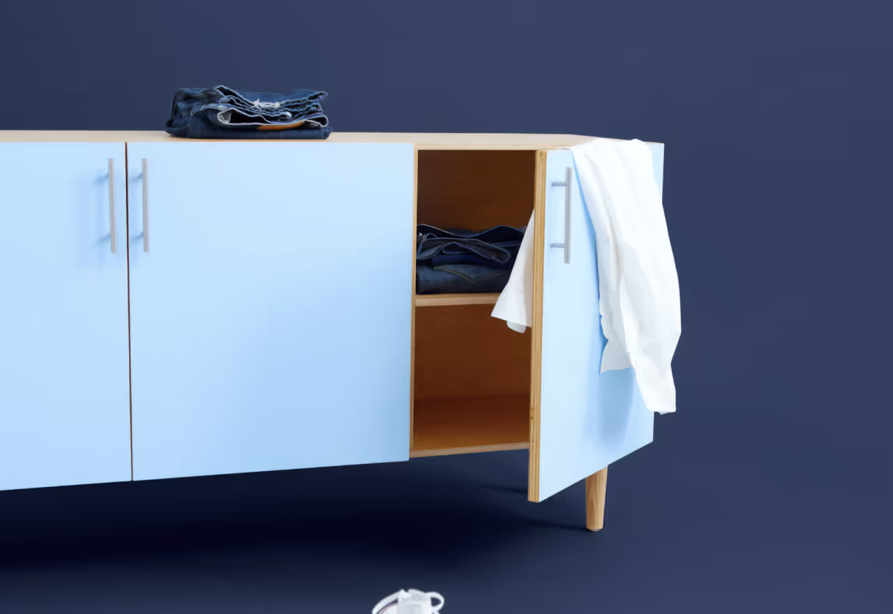 A blue cabinet with a drawer and a shelf.