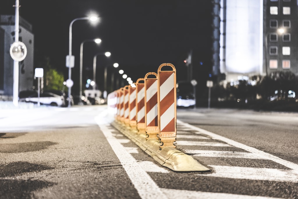 Traffic barriers in the middle of a road to indicate barriers to QA
