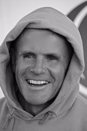 Hugh Murray smiling wearing a hoody