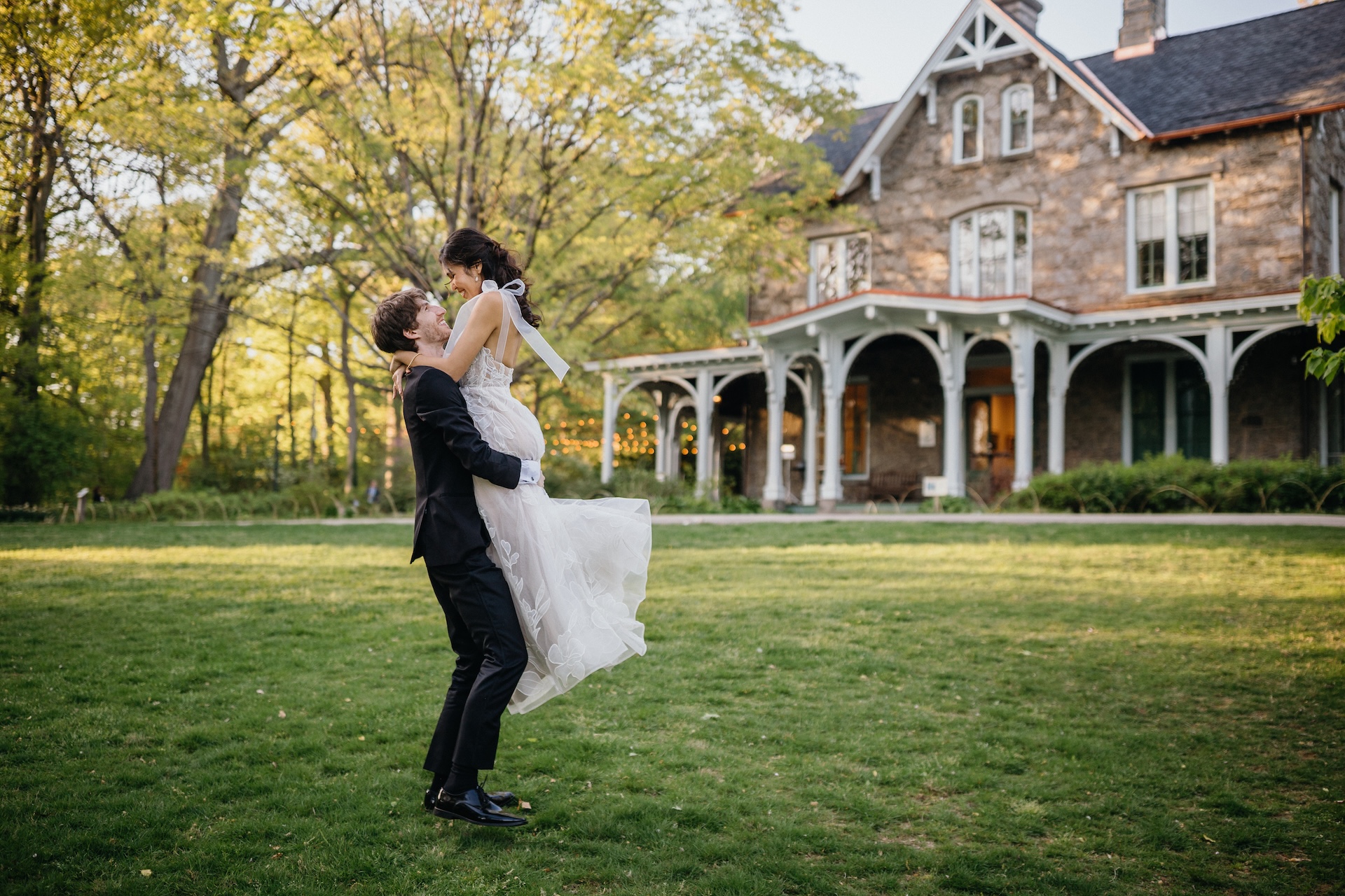 Couple greeting each other in the meadow just in front of the Cope House