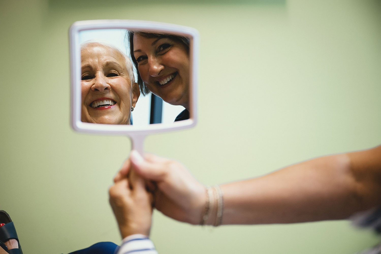 Hygienist with Father and Son with Mirror