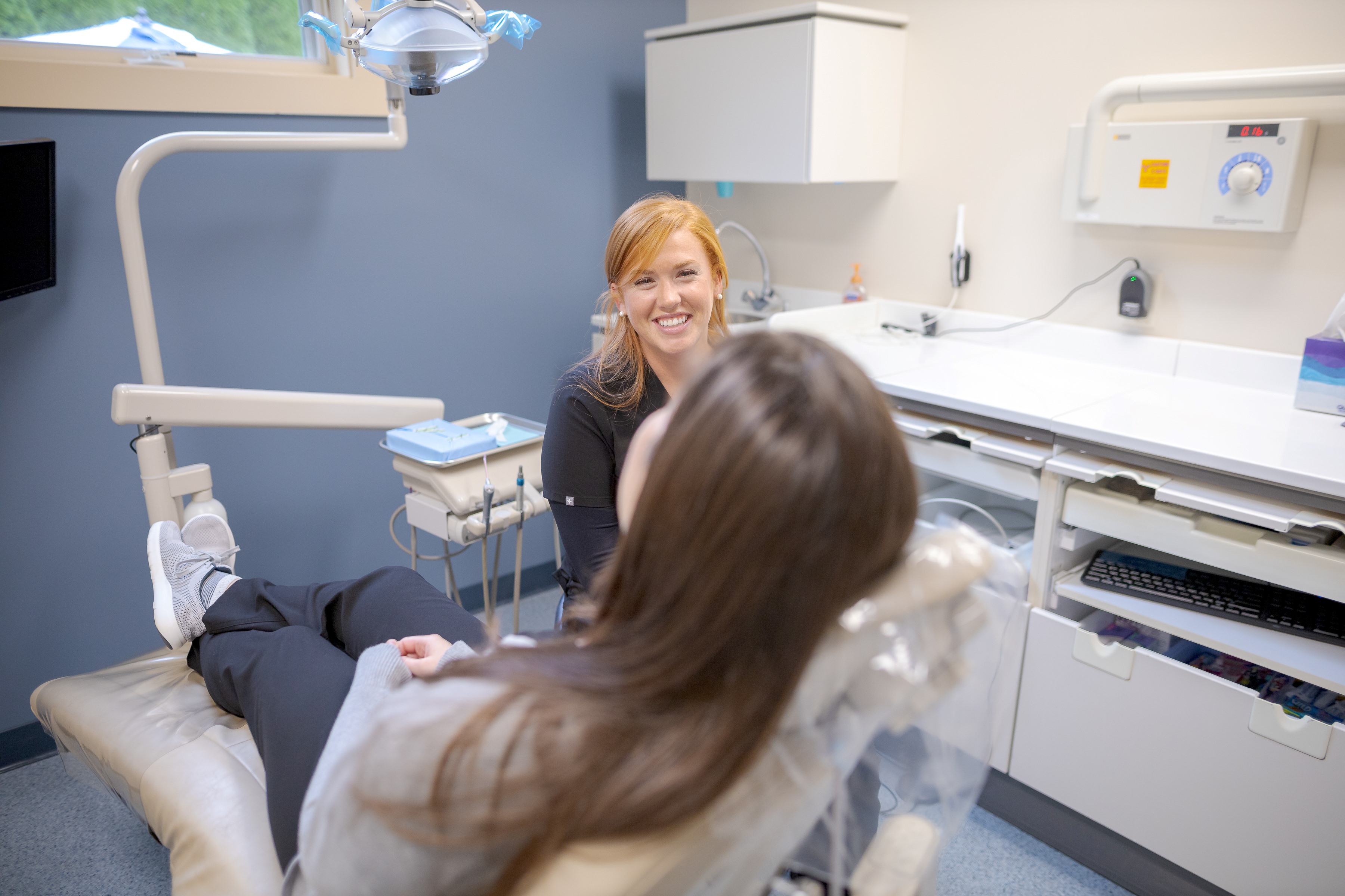 patient interacting with front desk
