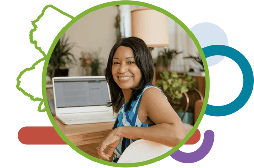 A female black entrepreneur smiles while registering her business.