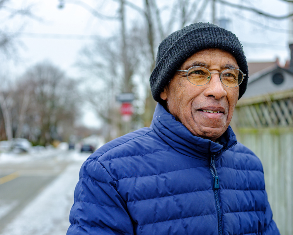 A photo of a man with a winter coat and hat.