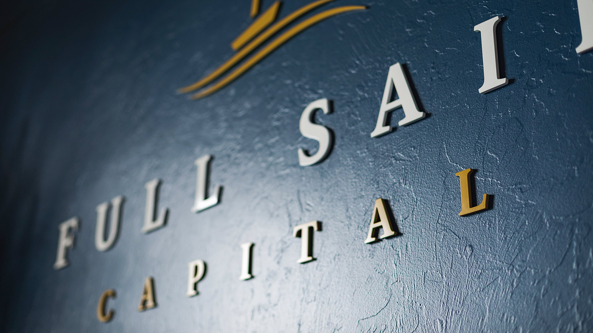 Full Sail Capital office interior signage with logo