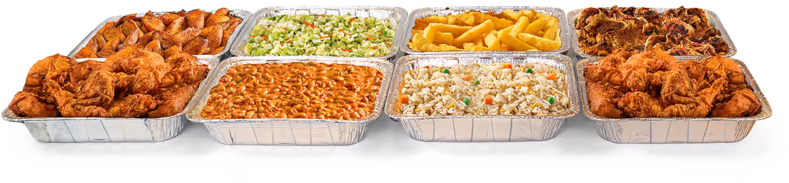 Catering spread in aluminum tins featuring fried chicken, Plantains, Yuca Fries, Cole Slaw. Beans and rice.