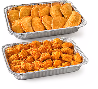 Catering spread in aluminum tins featuring Empenadas and Nuggets