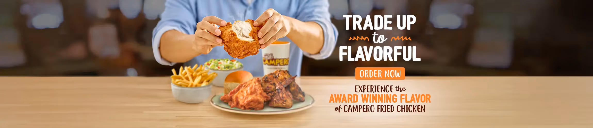 Picture of person holding fried chicken with the headline of "trade up to flavorful" and Order Now! 