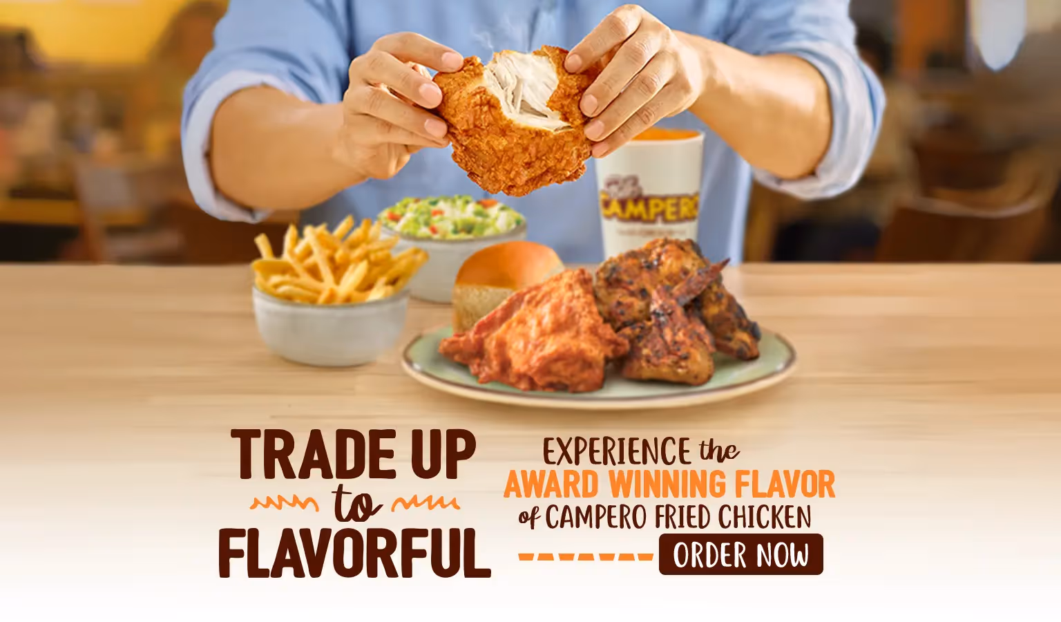 Picture of person holding fried chicken with the headline of "trade up to flavorful" and Order Now! 