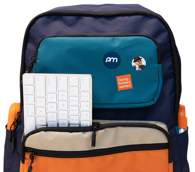 Backpack with buttons and keyboard hanging out of pocket