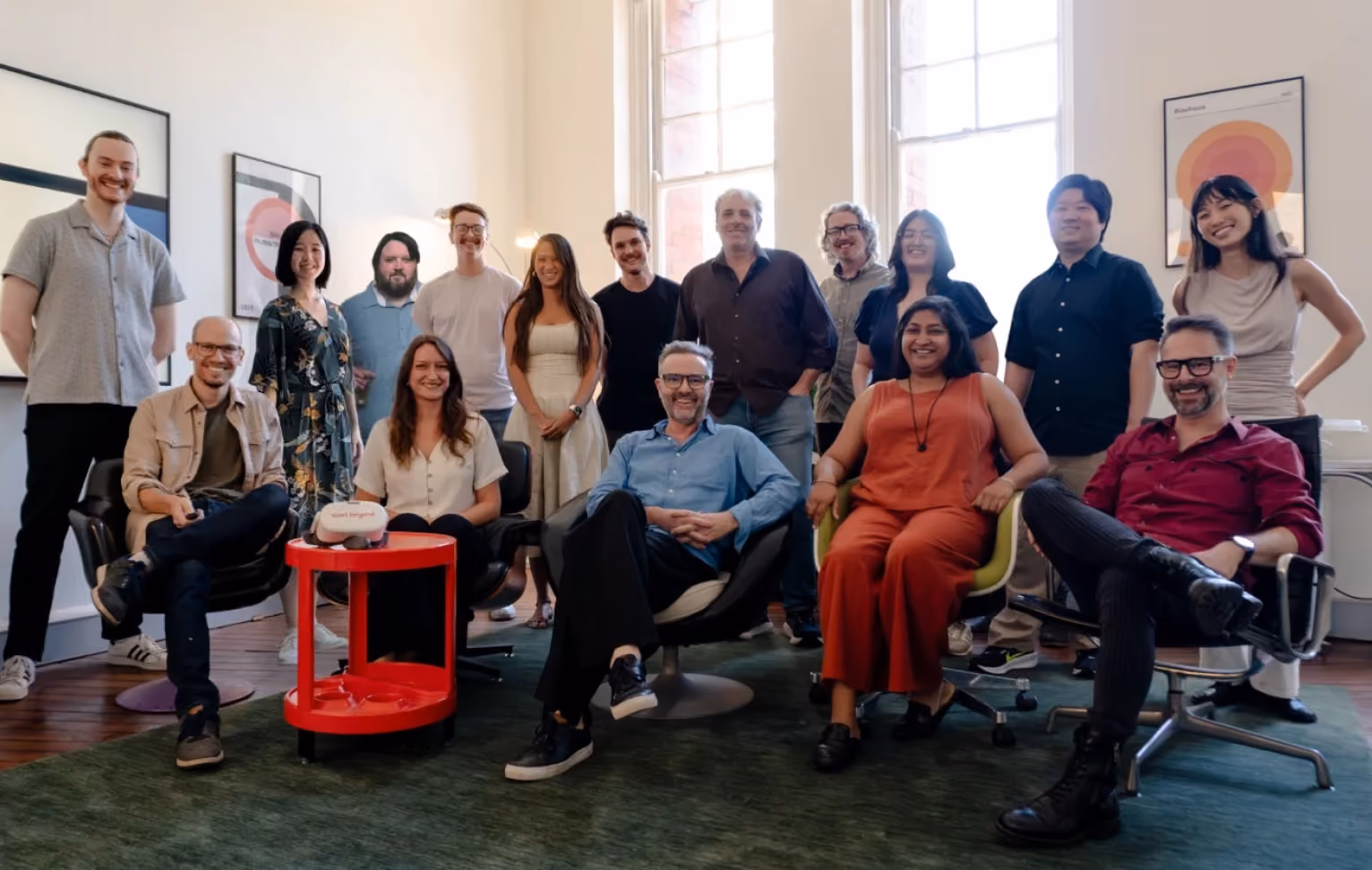 Group photo of the Start Beyond team smiling together in their office.