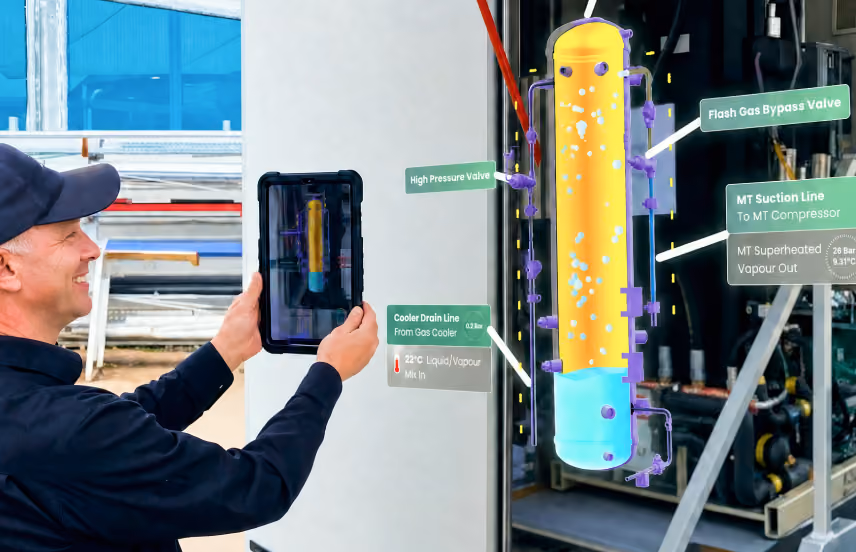 AR concept visualisation: a technician views a 3D model of refrigeration unit using a tablet, with label overlays and animation explaining machine process.